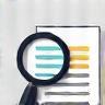 Icon of a magnifying glass over documents
